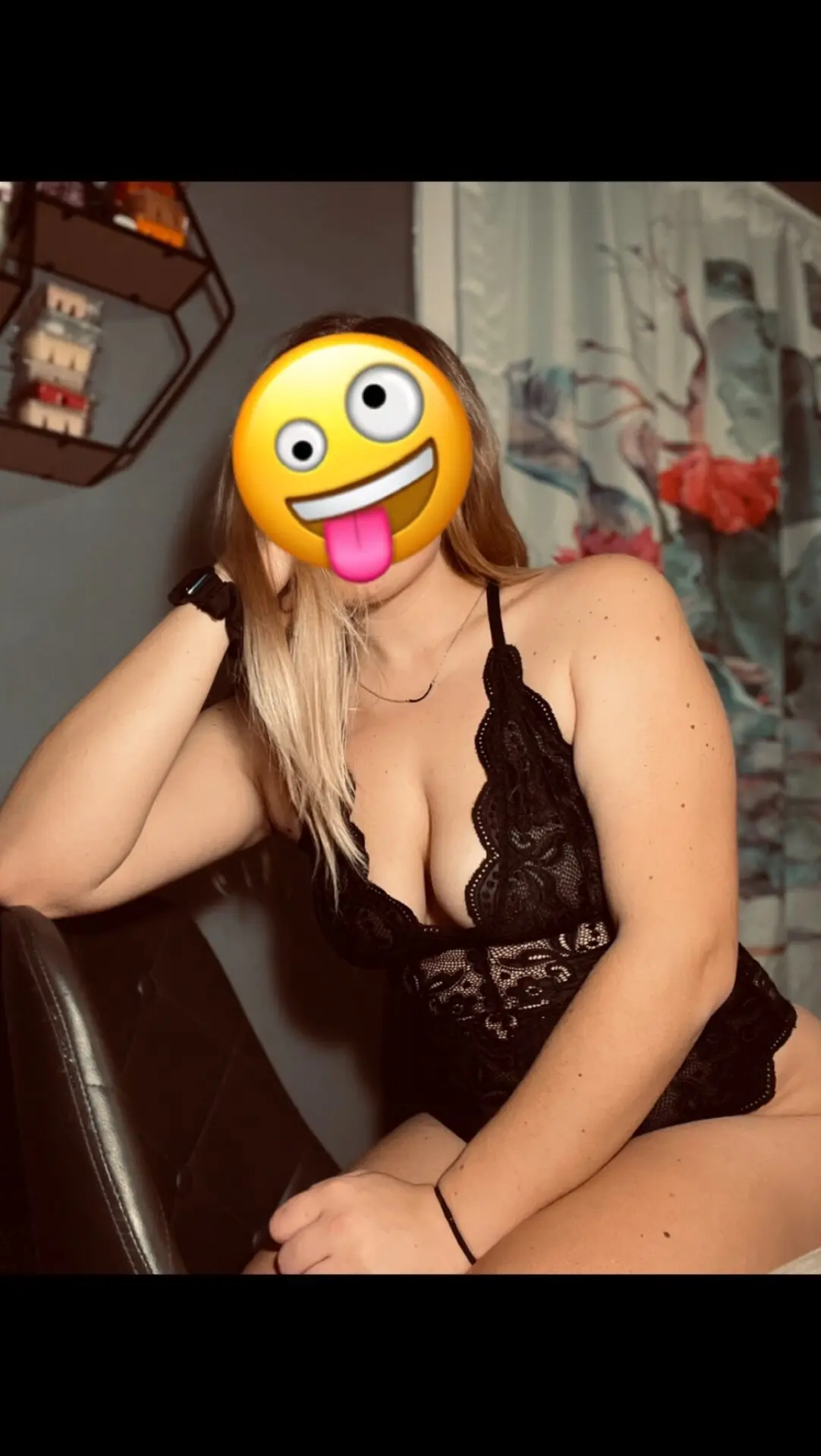 A woman lost in thought or emotion during a shoot