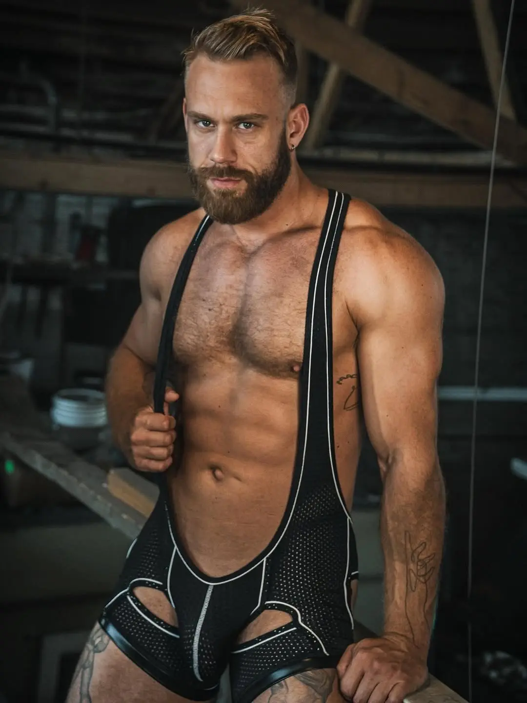 muscle guy in mesh body suit