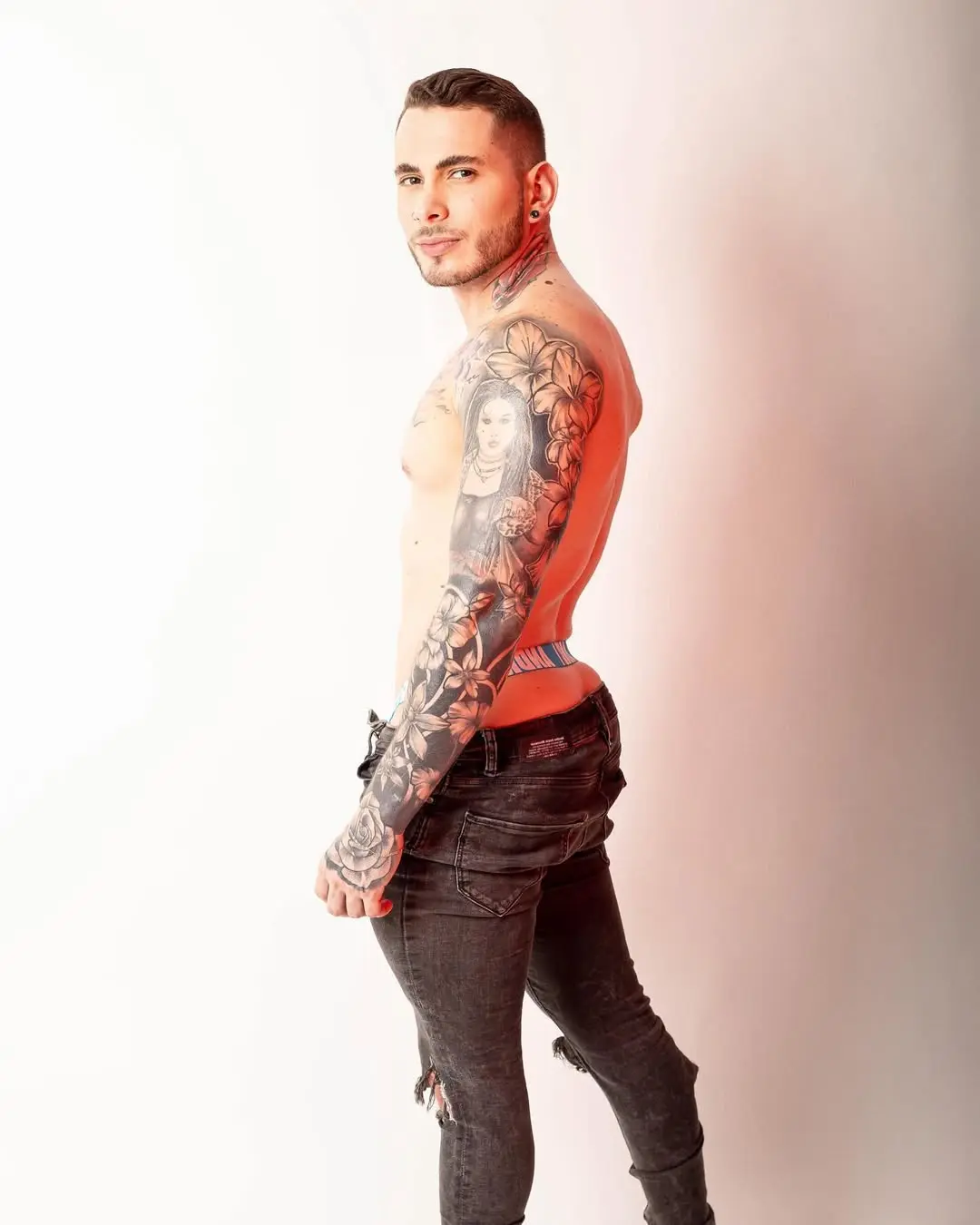 Latin tattoo stud in a jockstrap