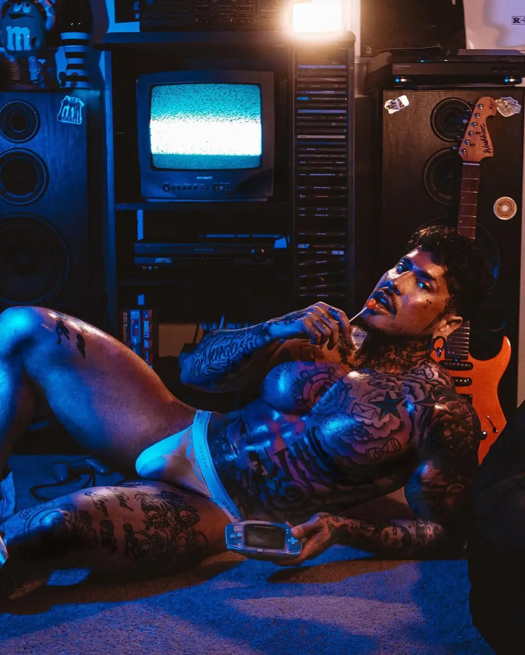 tattooed muscle man in jockstrap