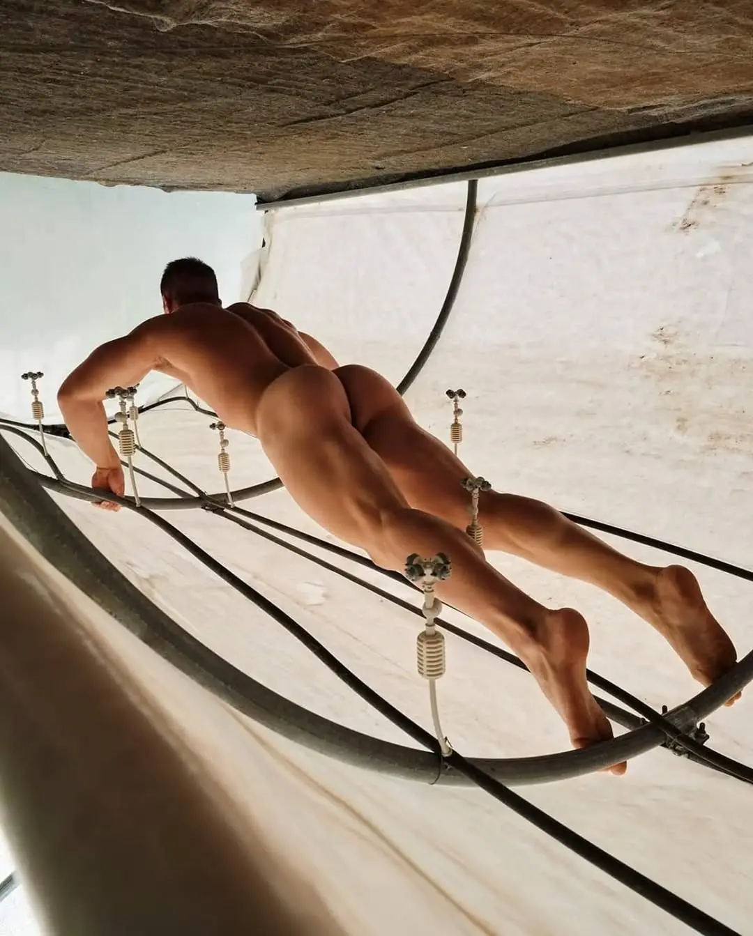 nude male muscle model with a bubble butt