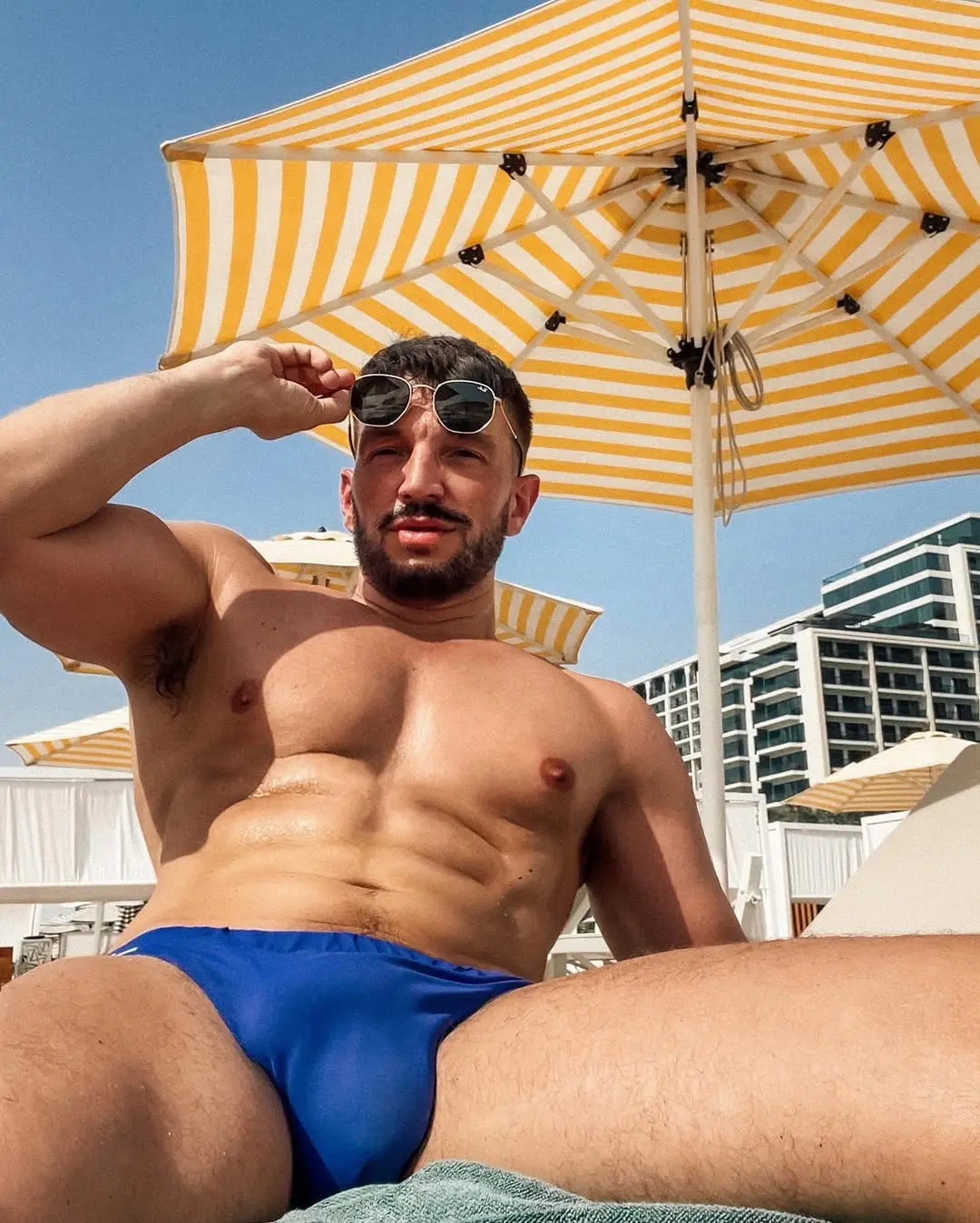hung muscle guy in Speedo